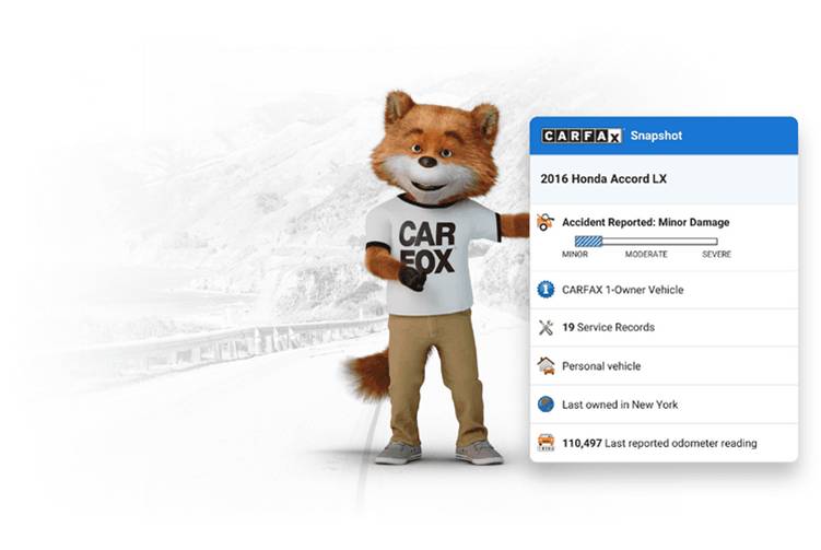 The Carfax Carfox holding a snapshot of a Carfax report.